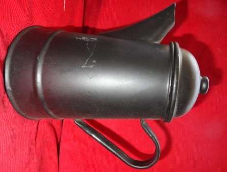 An used Polish made black enamel coffee kettle