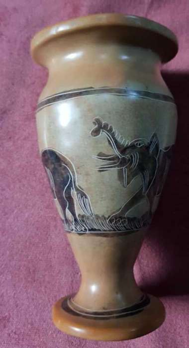 Ceramic vase with elephant images