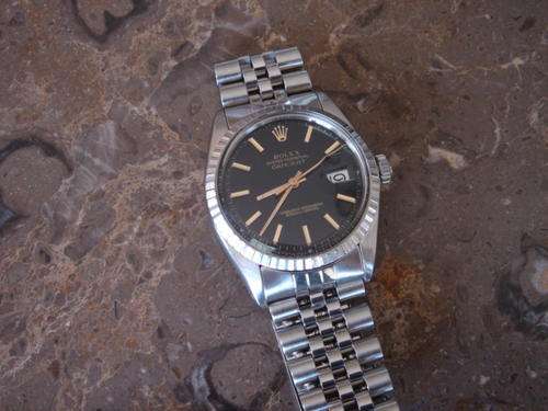 ROLEX DateJust (NOT A FAKE) with Black face. NO RESERVE
