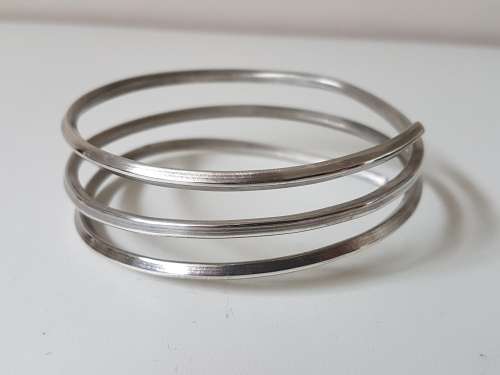 NEW Sterling Silver Coil Bracelet 3 Layered. Hallmarked 925 NEW. 45.8 grammes. Hand made. Not wire.