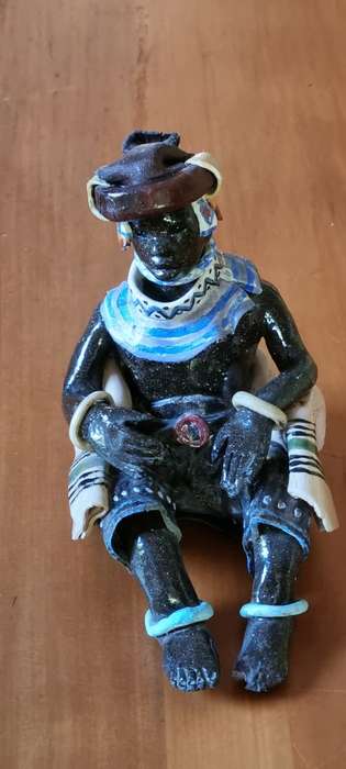 Ceramic figurine Xhosa Youth by Elizabeth Rowland.