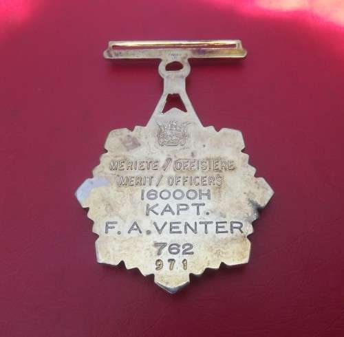 GOLD PLATED PRISON SERVICES MERIT OFFICERS MEDAL TO KAPT FA VENTER. STAMPED SILVER. NUMBERED.