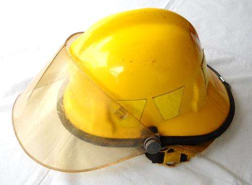 YELLOW FIRE HELMET WITH SHIELD-c1984-CAIRNS BROS-VERY GOOD CONDITION