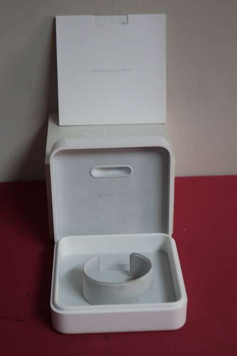Apple watch 42mm case with all the parts and papers that come with it.
