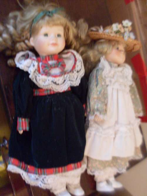 2 PRETTY PORCELAIN DOLLS...40 CM TALL EACH