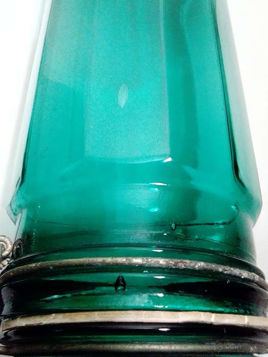 Hand Blown Green Preservation Bottles with glass lids.