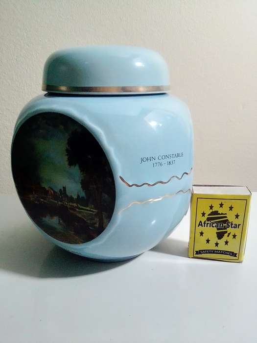 A Twinings Tea lidded canister + wood box with 3 partitions/clasp filled with 15 Cookie cutters.