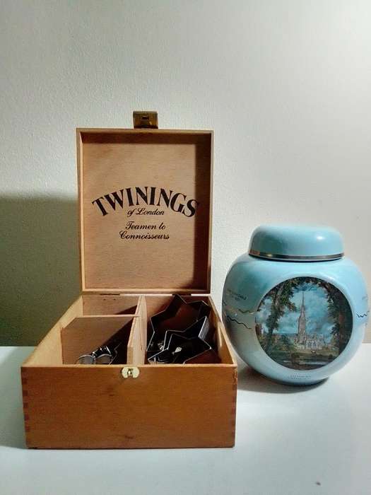 A Twinings Tea lidded canister + wood box with 3 partitions/clasp filled with 15 Cookie cutters.