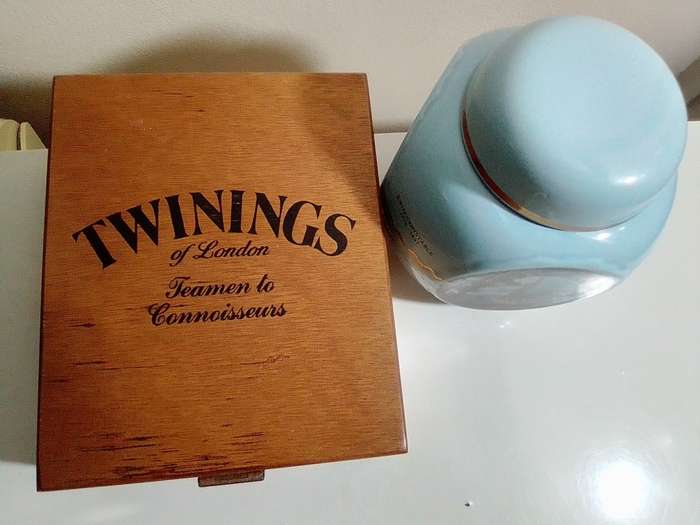 A Twinings Tea lidded canister + wood box with 3 partitions/clasp filled with 15 Cookie cutters.