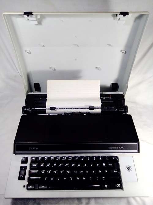 A Brother Typewriter in original case, In working condition.
