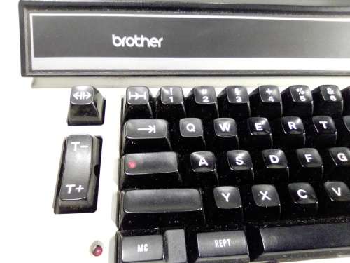 A Brother Typewriter in original case, In working condition.