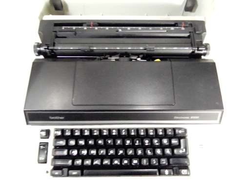 A Brother Typewriter in original case, In working condition.