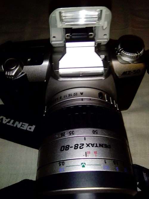 A Pentax AZ50 with 28-80mm lens in carry bag. In fair used condition.