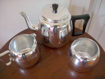 SILVER METAL TEA SET.