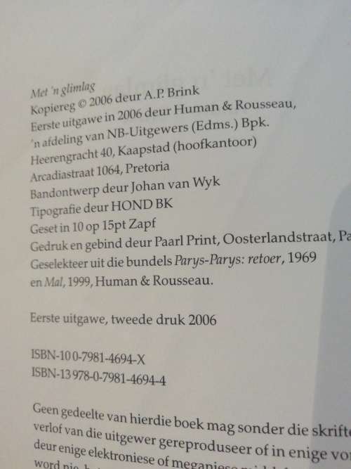 Met `n glimlag / Andre P Brink