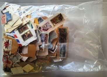 Plastic packet of Worldwide and RSA stamps - refer to photos