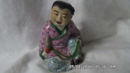 HANDCRAFTED AND HANDPAINTED MULTI-COLOURED CHINESE FIGURINE.