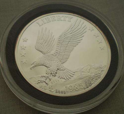 1985-LIBERTY ART ROUND A-MARK-1TROY OZ.999 FINE SILVER