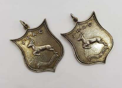 Set of 2 Silver Springbok medals commemorating Jackie Gibson for relay in 1949 in original box app