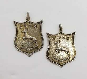 Set of 2 Silver Springbok medals commemorating Jackie Gibson for relay in 1949 in original box app