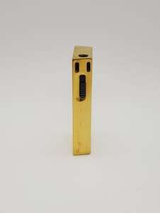 Electronic Ronson lighter shaped as a gold bar - as per photo