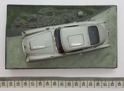Aston Martin DB5 - Goldfinger model car  - casing cracked, broken mirror and missing light