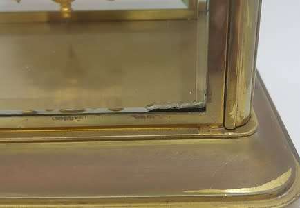 Antique French mantel clock with brass and glass casing - some damage to face and glass - no bell
