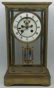 Antique French mantel clock with brass and glass casing - some damage to face and glass - no bell