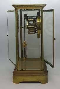 Antique French mantel clock with brass and glass casing - some damage to face and glass - no bell