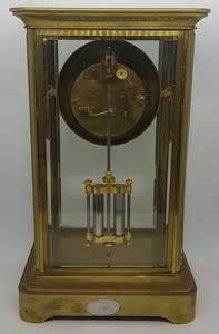 Antique French mantel clock with brass and glass casing - some damage to face and glass - no bell