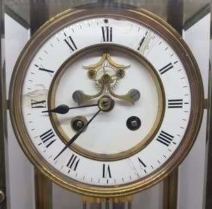 Antique French mantel clock with brass and glass casing - some damage to face and glass - no bell