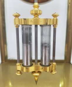 Antique French mantel clock with brass and glass casing - some damage to face and glass - no bell