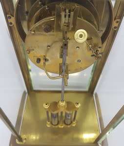 Antique French mantel clock with brass and glass casing - some damage to face and glass - no bell