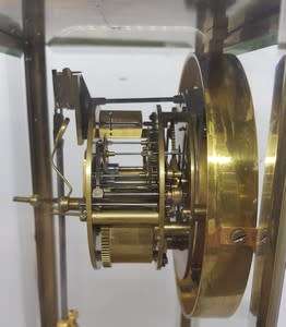 Antique French mantel clock with brass and glass casing - some damage to face and glass - no bell
