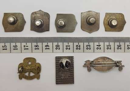 Lot of 8 different badges - as per scan