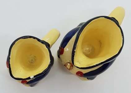 Pair of miniature character jugs - as per photo