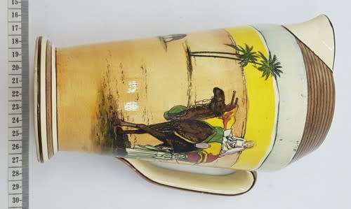Royal Doulton `Desert scene` jug with hairline crack - as per photo