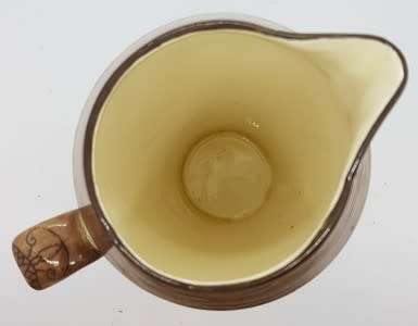 Royal Doulton `Desert scene` jug with hairline crack - as per photo