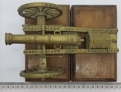 Plastic Model Canon on wooden stand - as per photo