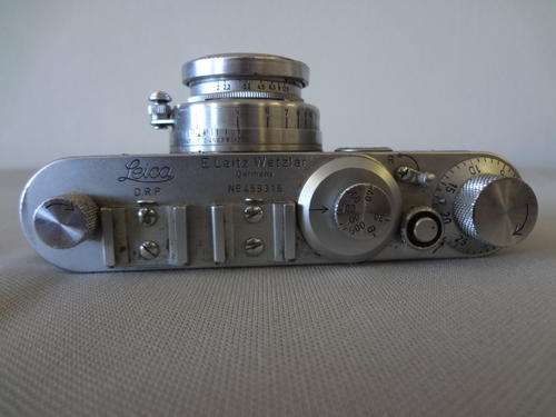 Leica camera in leather bag with extra eyepiece and timer with F1:2 lens model no:459316 as per scan
