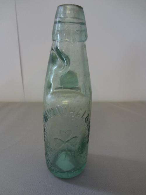 Old glass bottle with marble as per photo
