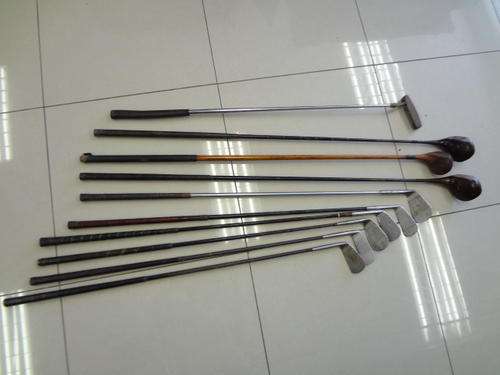 Antique golf bag and 8 clubs - as per photo