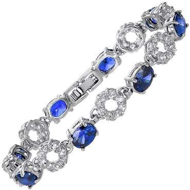 **STUNNING OVAL CUT BLUE SAPPHIRE TENNIS BRACELET SET IN WHITE GOLD**
