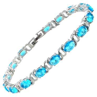 **STUNNING OVAL CUT AQUAMARINE TENNIS BRACELET SET IN WHITE GOLD**