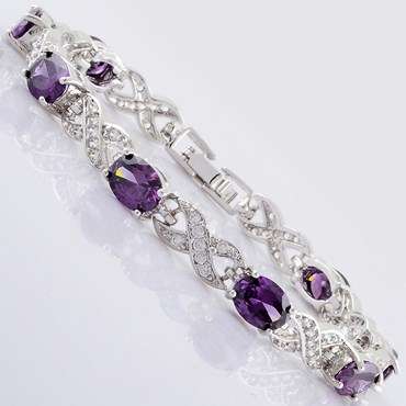 **STUNNING OVAL CUT PURPLE AMETHYST BRACELET SET IN WHITE GOLD**