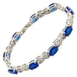 **STUNNING OVAL CUT BLUE SAPPHIRE BRACELET SET IN WHITE GOLD**