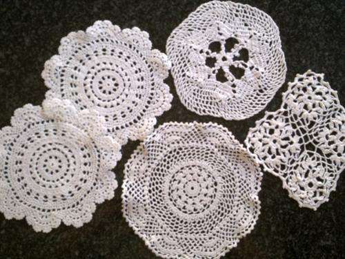 Lot of five white cotton doilies