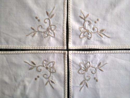 Five vintage cocktail napkins with embroidered corner
