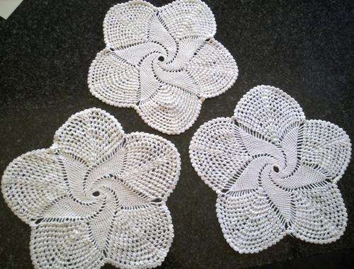 Three pretty cotton pinwheel crochet doilies