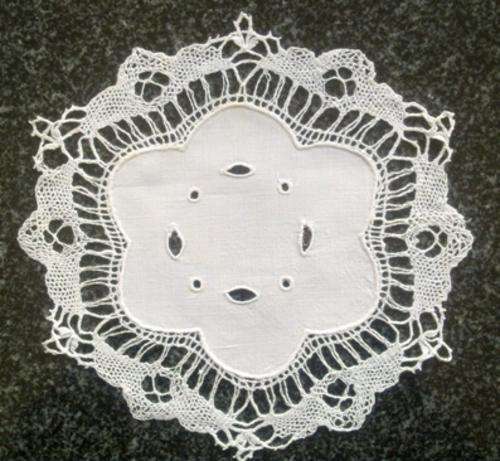 Antique linen and bobbin lace doilie